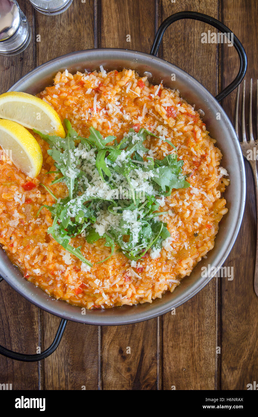 Red pepper risotto with Parmesan and rocket Stock Photo - Alamy
