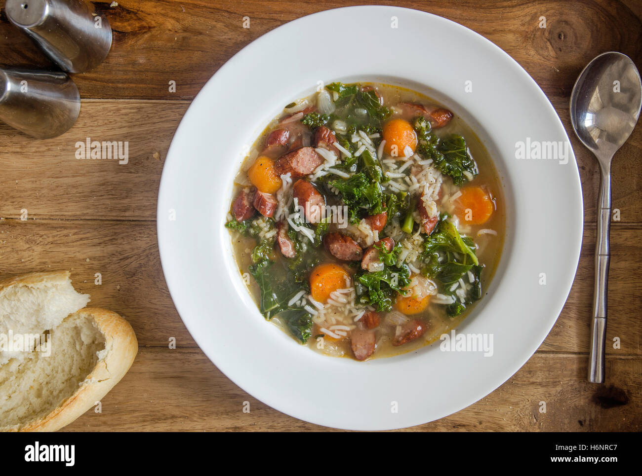 Polish soup with sausage, rice and kale Stock Photo