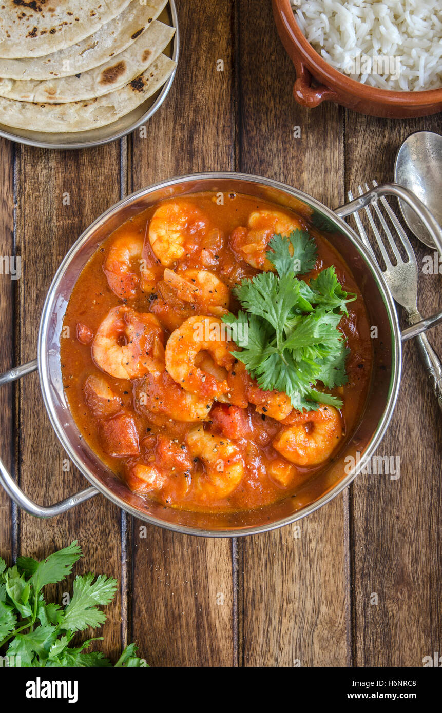 Indian prawn curry with rice and chapatis Stock Photo