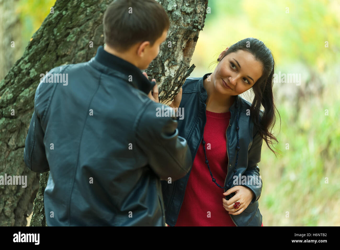 Affectionate couple taking walk in autumn park Stock Photo - Alamy