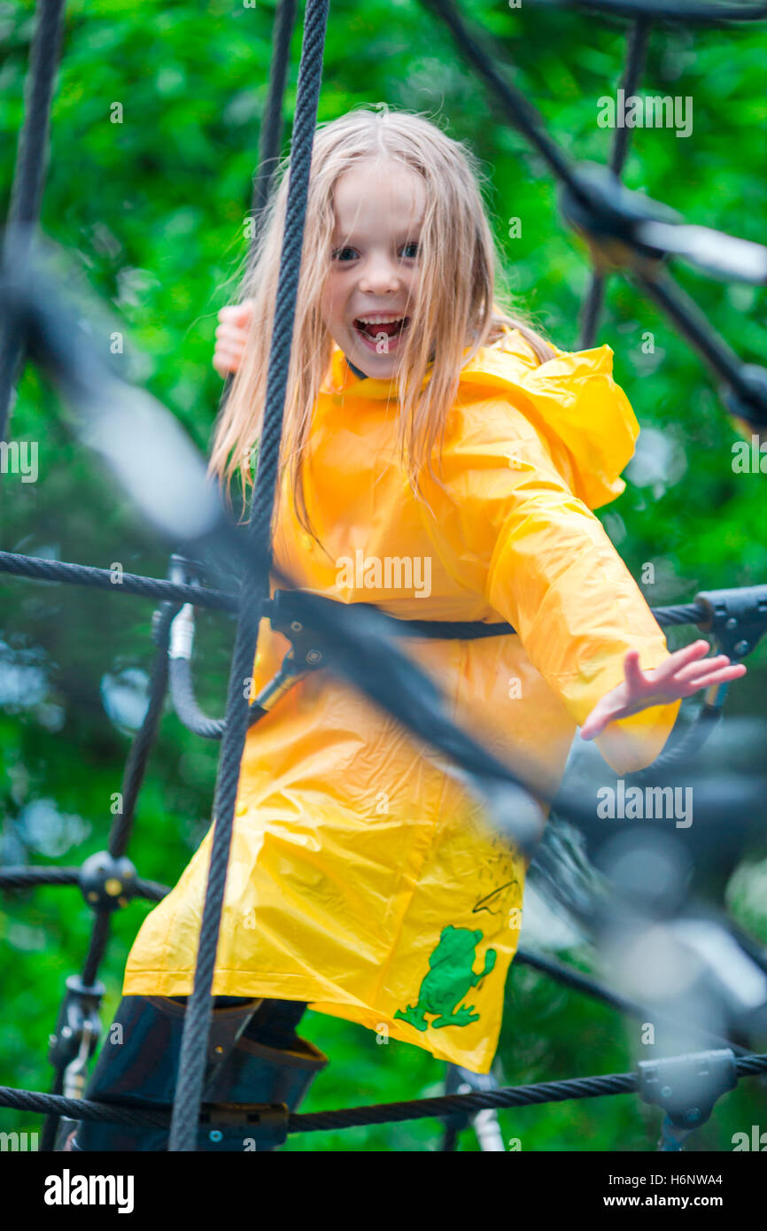 Happy little girl playing on outdoor playground in autumn day Stock ...