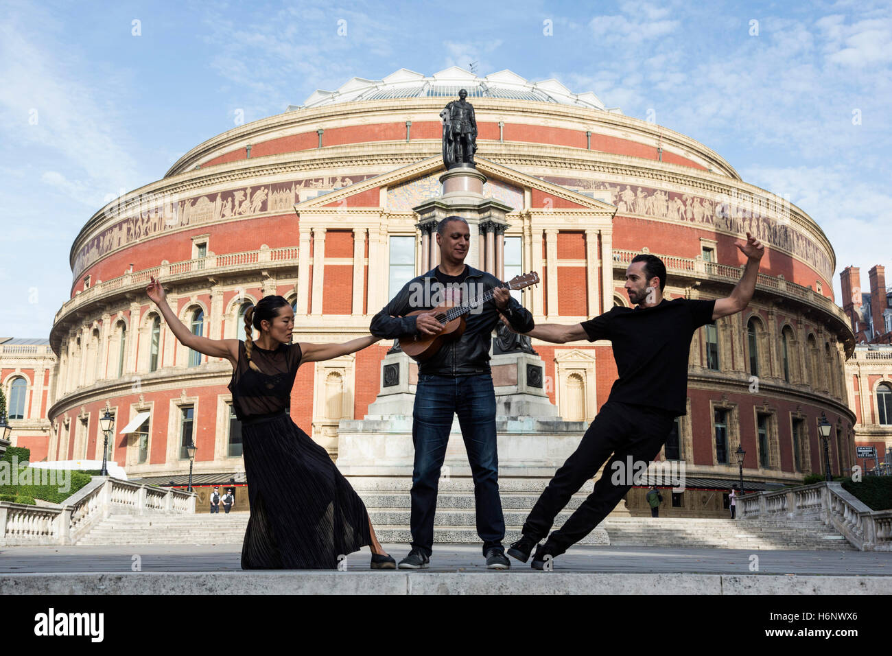 London, UK. 31 October 2016. British Indian musician, producer and composer Nitin Sawhney will perform a one-off show at the Royal Albert Hall on Wednesday, 2 November, featuring music from his latest album Dystopian Dream. At a photocall on the QEII Diamond Jubilee Steps outside the Royal Albert Hall, Sawhney poses with hip hop dancers Sebastien Ramirez and Honji Wang. Stock Photo