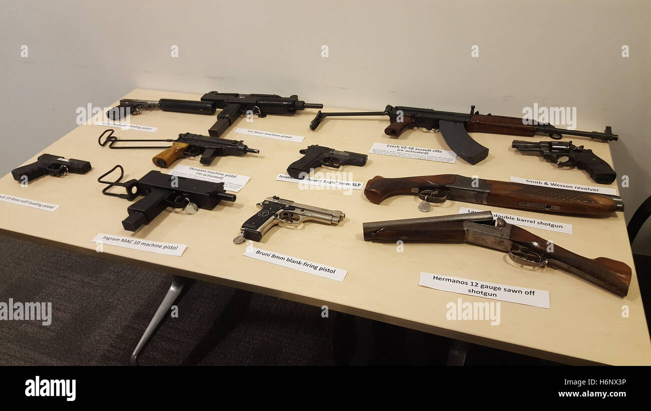 Guns seized by the National Crime Agency are displayed in London during