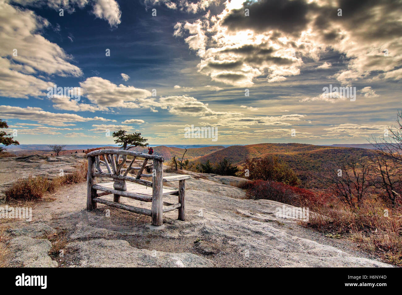 Wooden Bench located on top of Bear Mountain State Park, NY Stock Photo