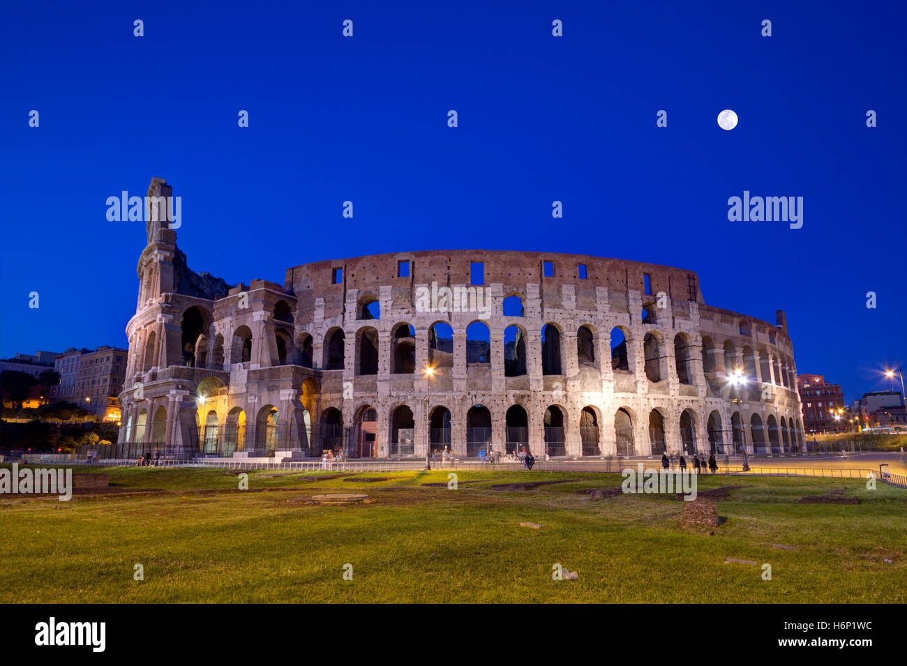 Coliseum By Night With Full Moon In Roma, Italy Stock Photo - Alamy