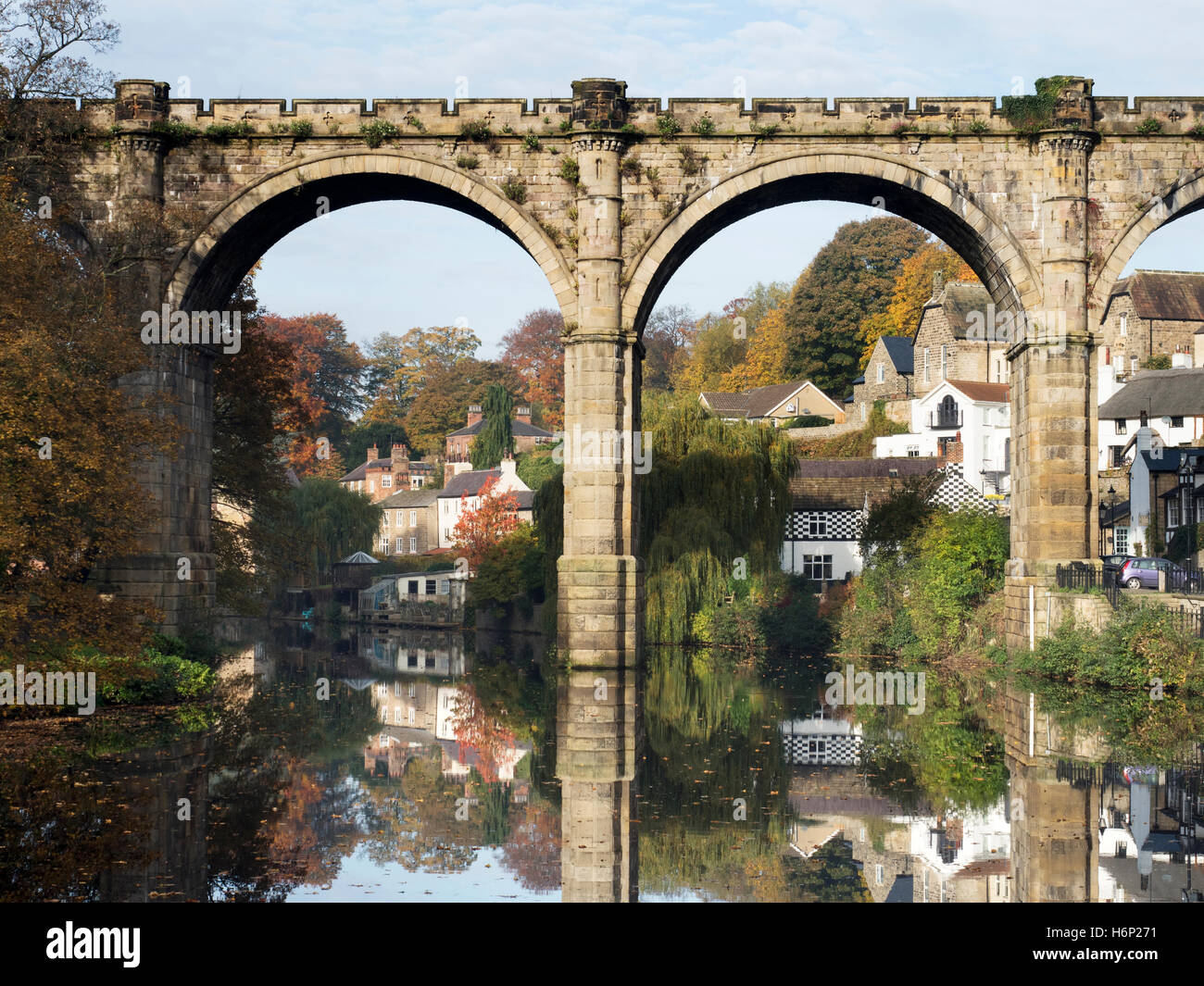Railway Viaduct Reflected in the River Nidd in Autumn Knaresborough North Yorkshire England Stock Photo