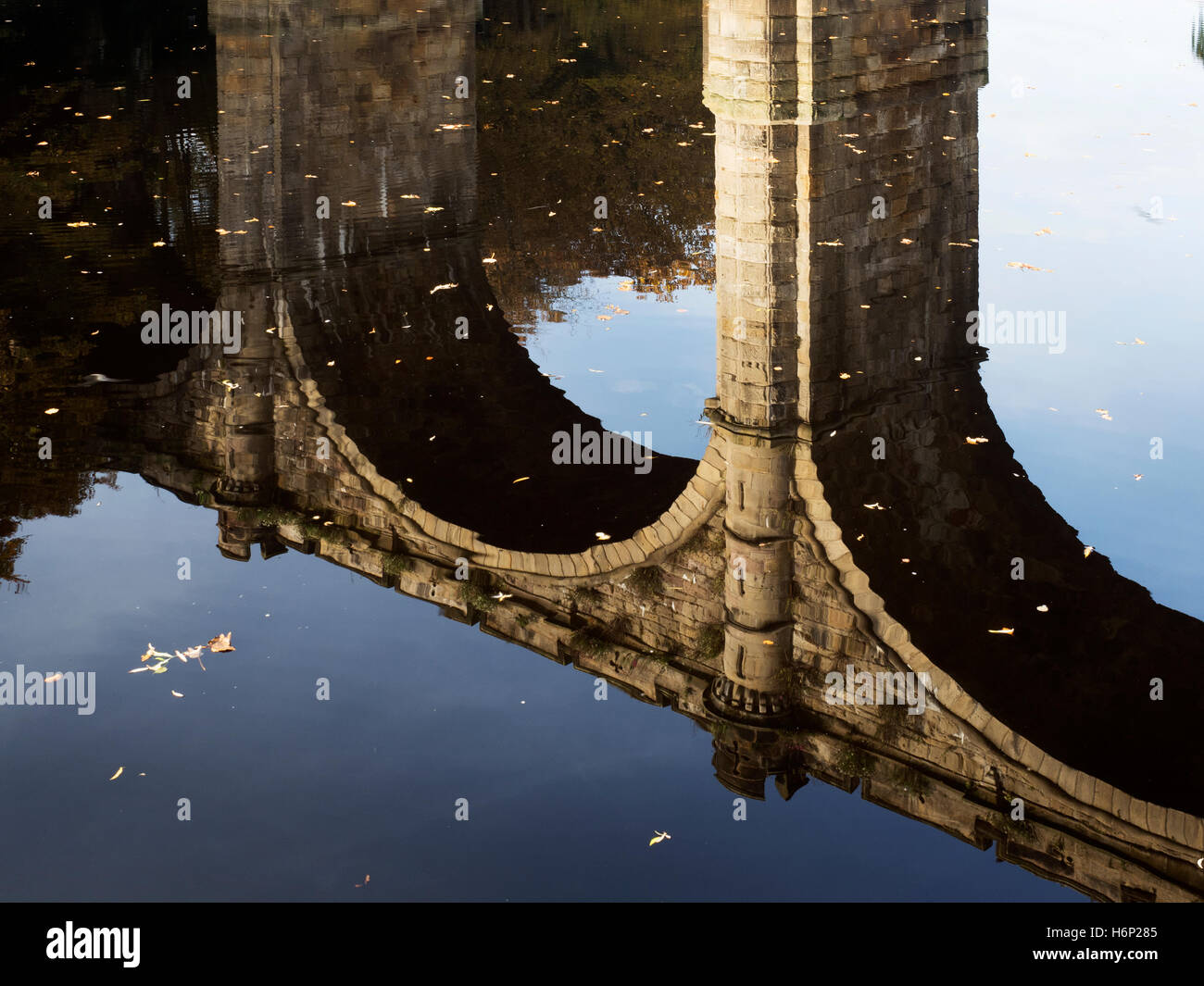 Railway Viaduct Reflected in the River Nidd in Autumn Knaresborough North Yorkshire England Stock Photo