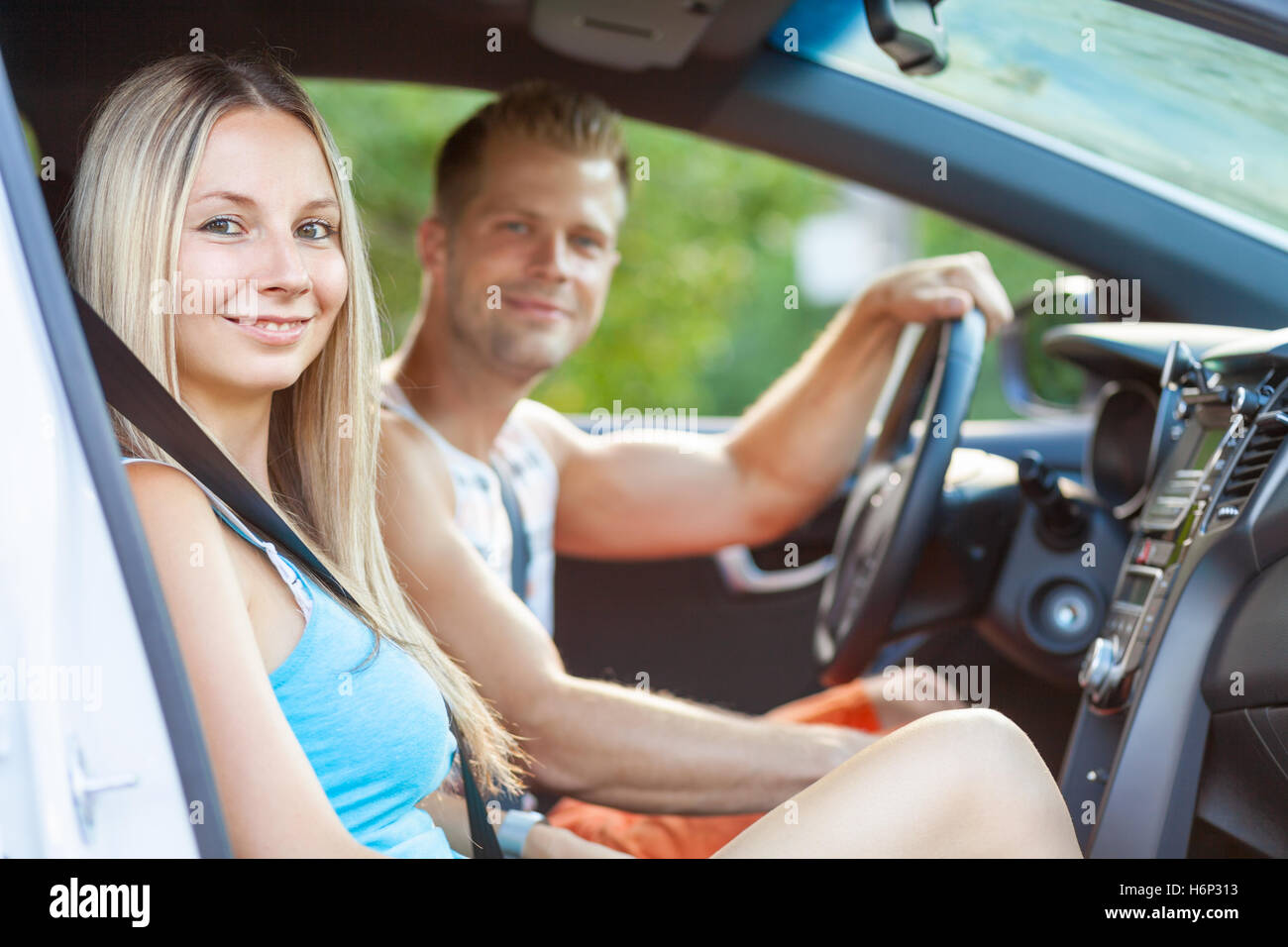 Young happy people enjoying a roadtrip in the car Stock Photo - Alamy