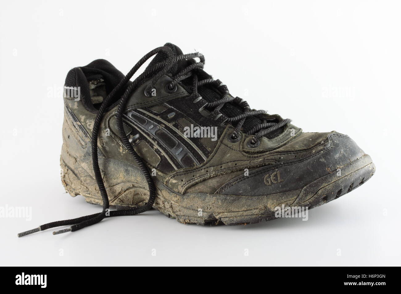 dirty old running shoe Stock Photo - Alamy