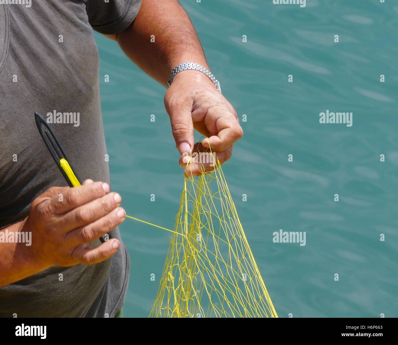 Angle fish net fishing harbours hi-res stock photography and images - Alamy