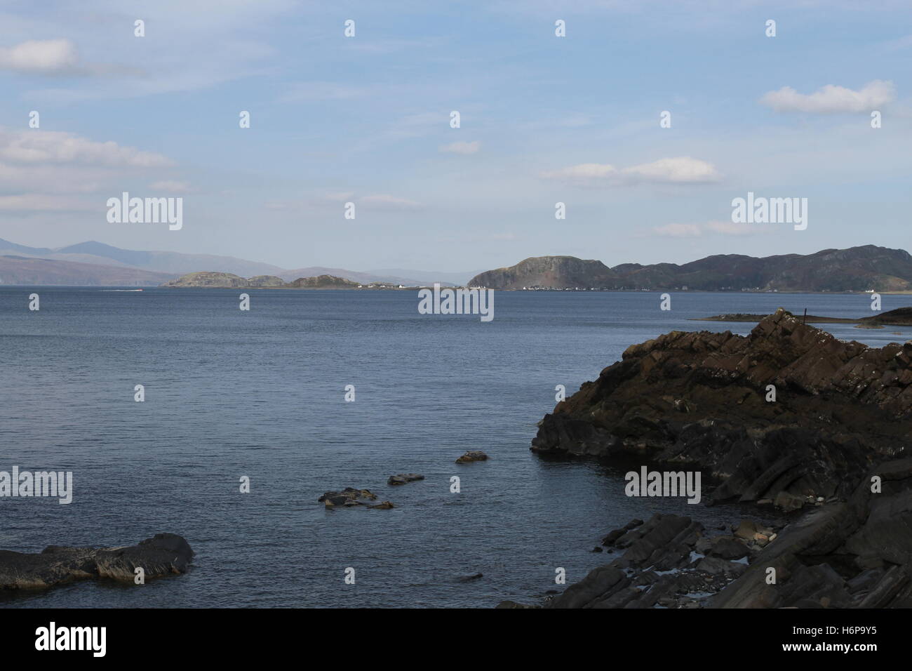 Distant views of Isle of Easdale and Ellenabeich viewed from Isle of Luing Scotland  September 2013 Stock Photo
