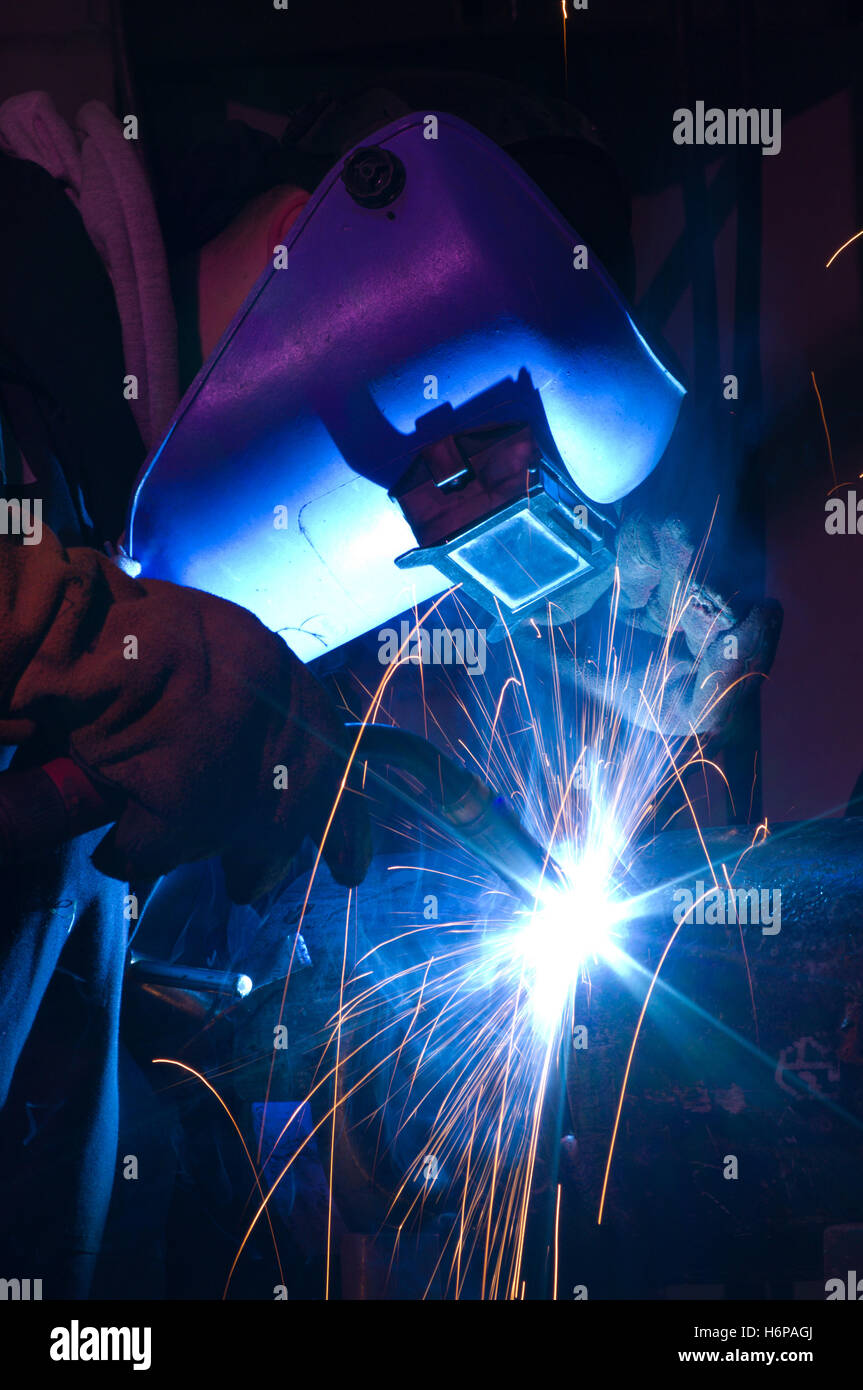 engineering manufacturing welding sparks welder blue tool colour workshop industry engineering black swarthy jetblack deep Stock Photo