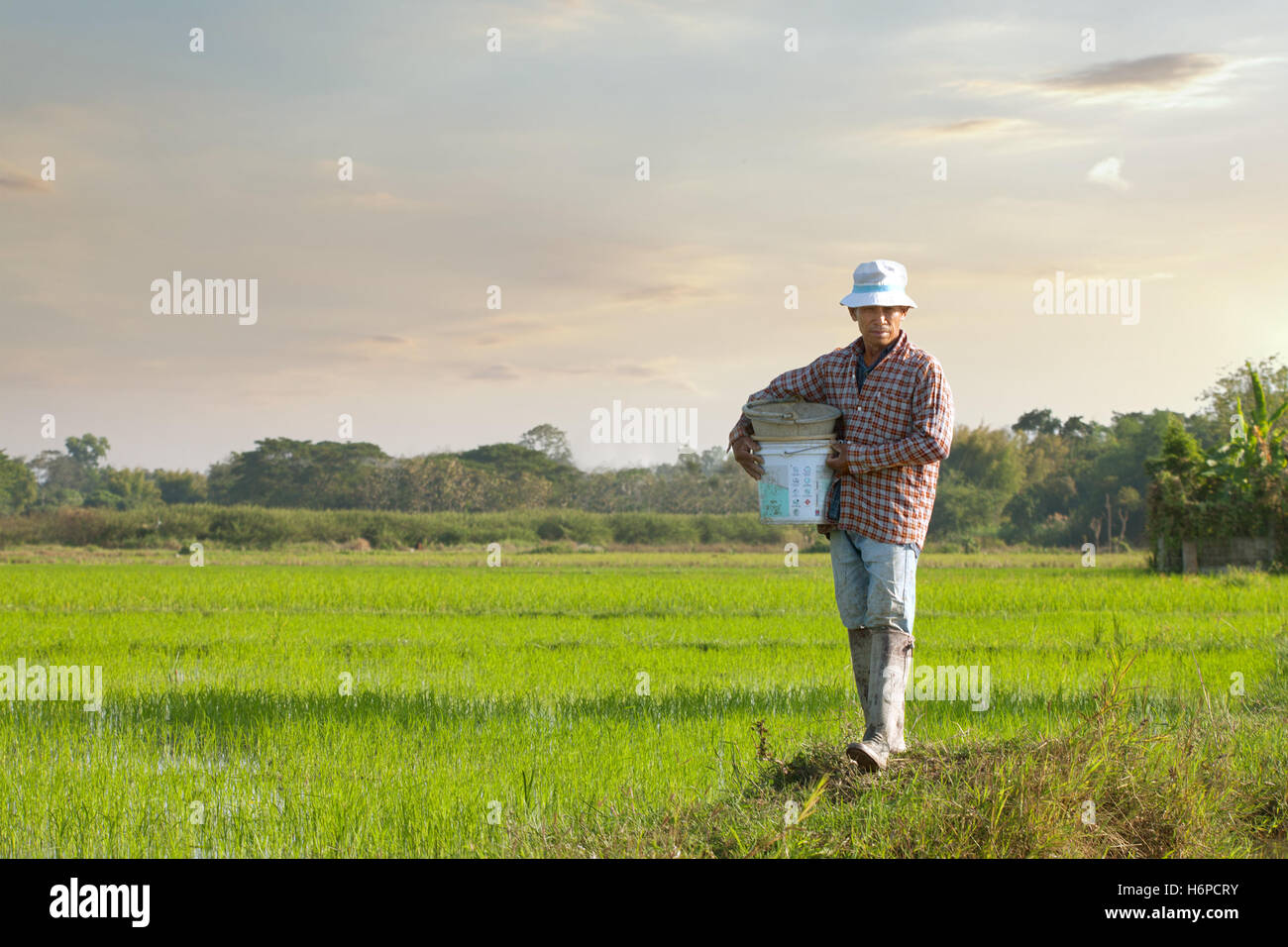 close up portrait of thai  farmer on color background Stock Photo