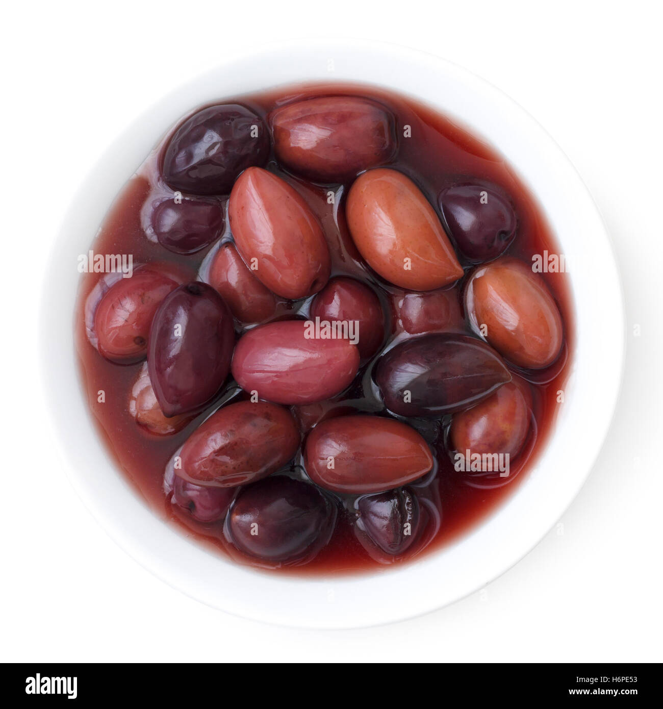 Bowl of Kalamata Greek olives. Isolated from above. Stock Photo