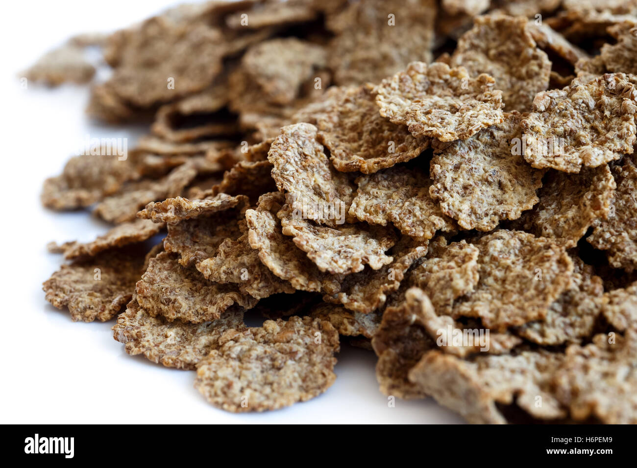 Close up detail of wheat bran breakfast cereal flakes as a background ...