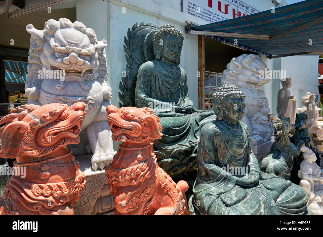 Marble statues displayed in front of a shop. The Marble Mountains, Da Nang, Vietnam Stock Photo