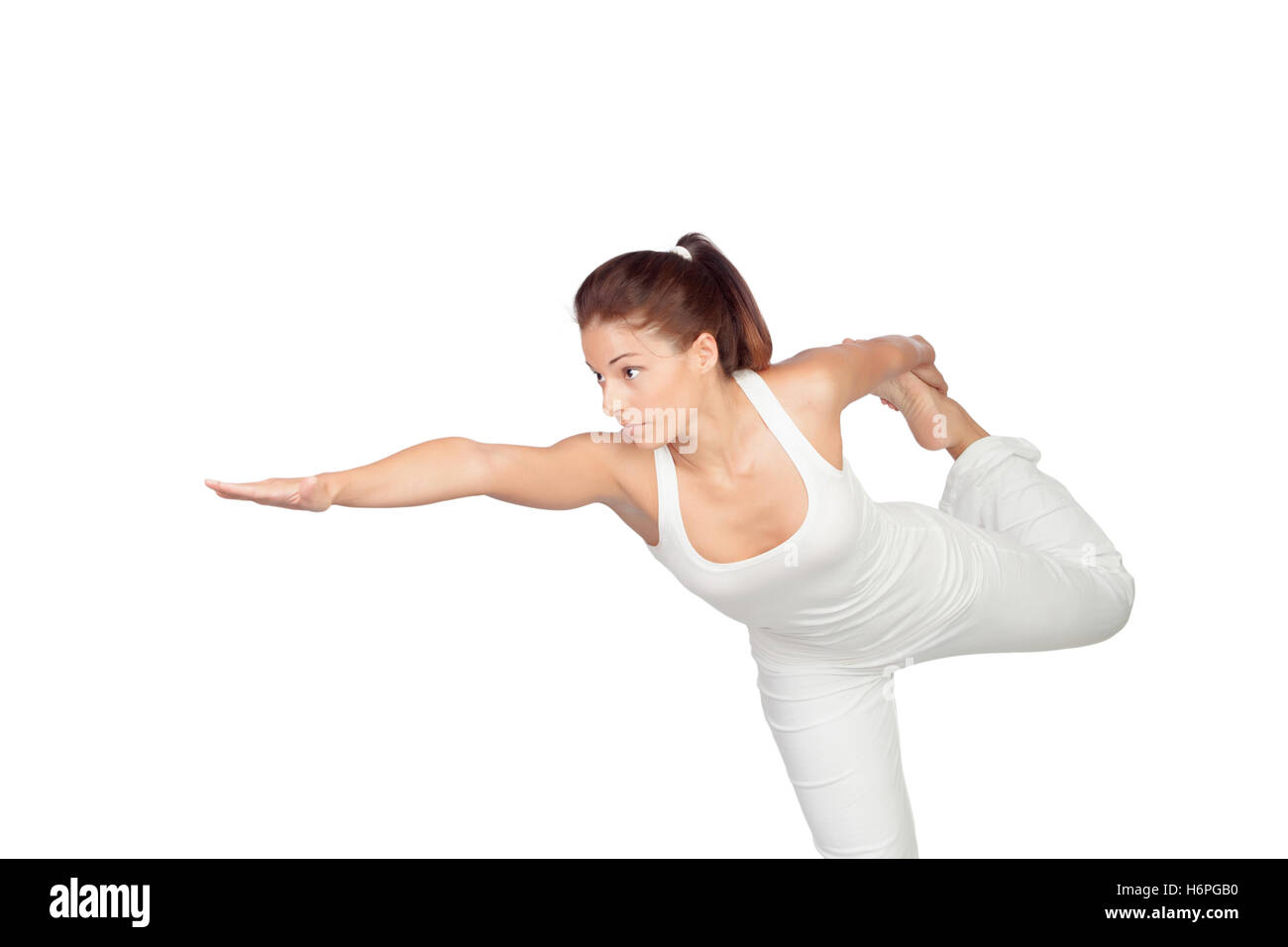 Brunette woman in white doing stretching isolated Stock Photo