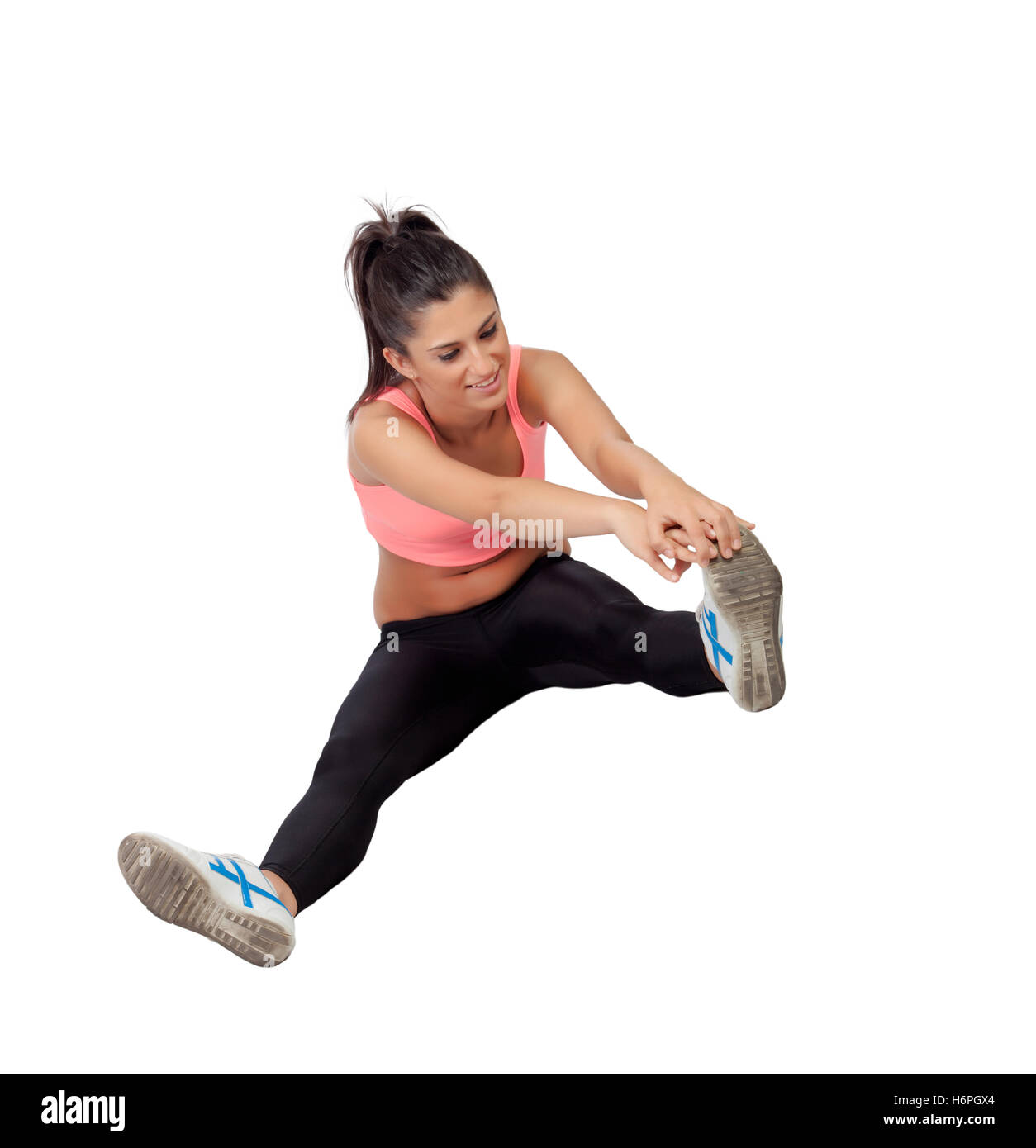 Pretty woman doing stretching into her workout isolated on white background Stock Photo