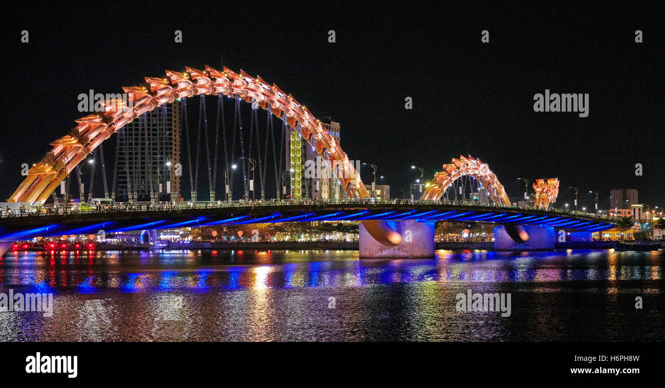Dragon Bridge (Cau Rong) over the River Han illuminated at night. Da Nang city, Vietnam. Stock Photo