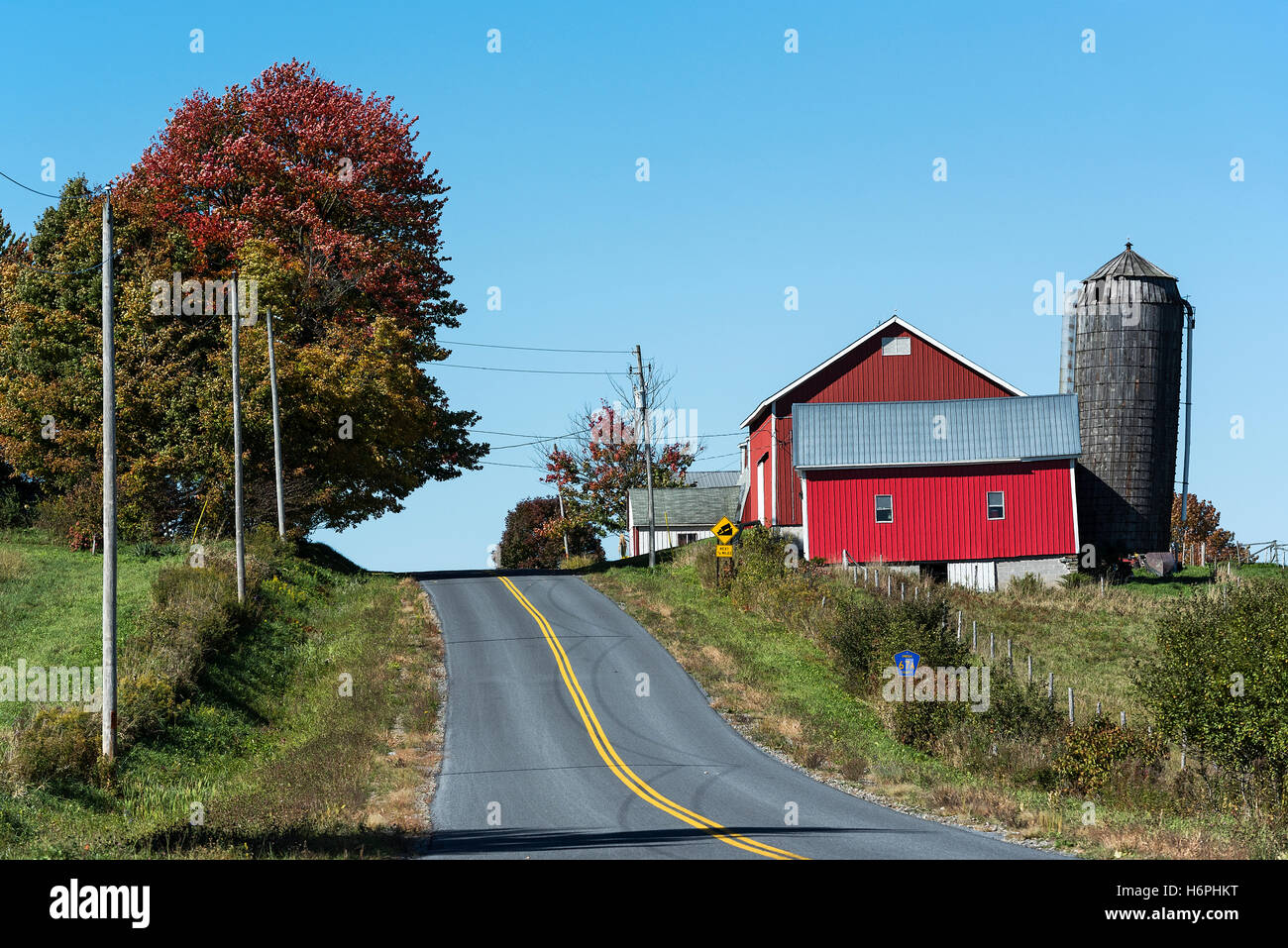 Country road and red barn, Oneida County, New York, USA. Stock Photo