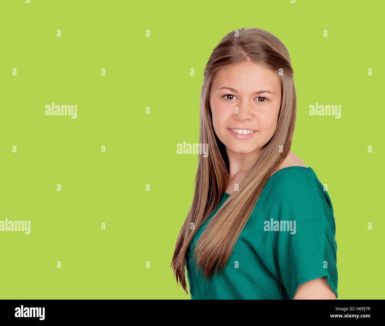 Beautiful young girl with tshirt on green background Stock Photo Alamy