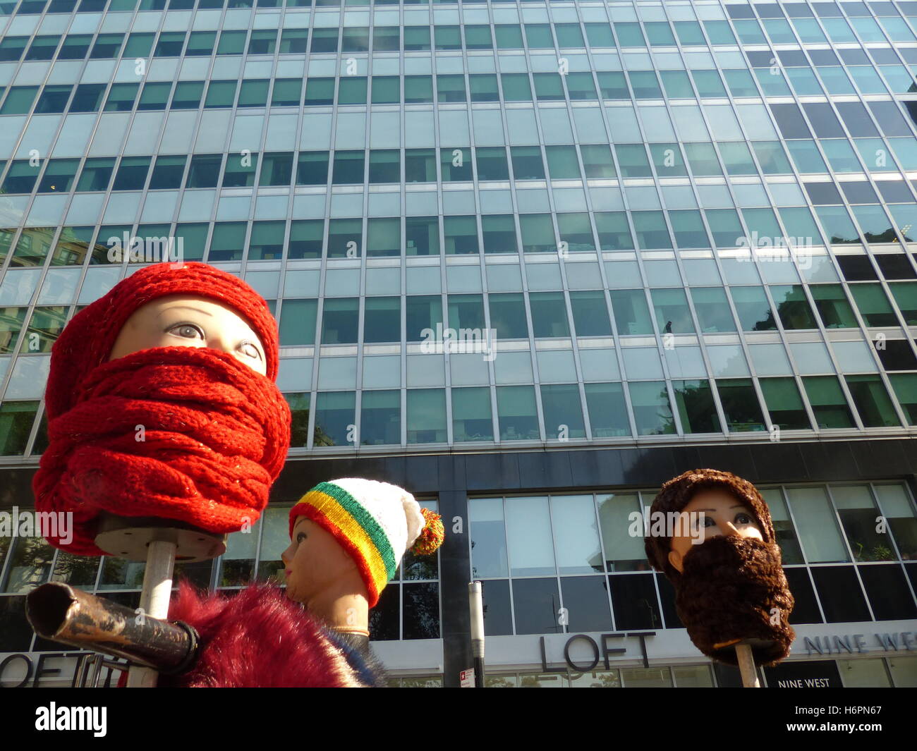 Apparel street vendor using mannequins to display items for sale Stock