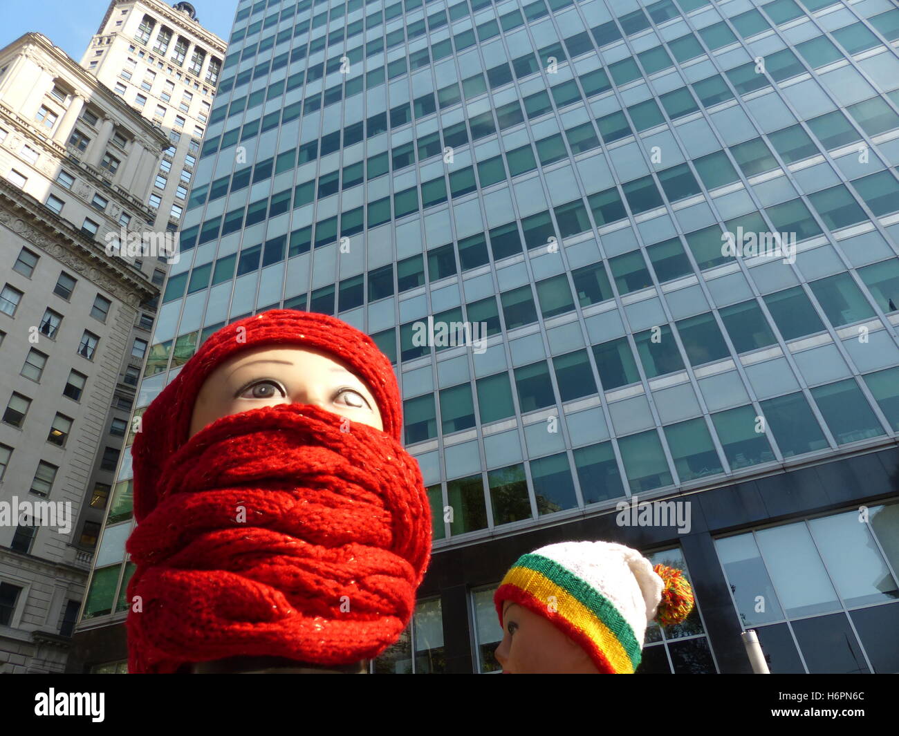 Apparel street vendor using mannequins to display items for sale Stock
