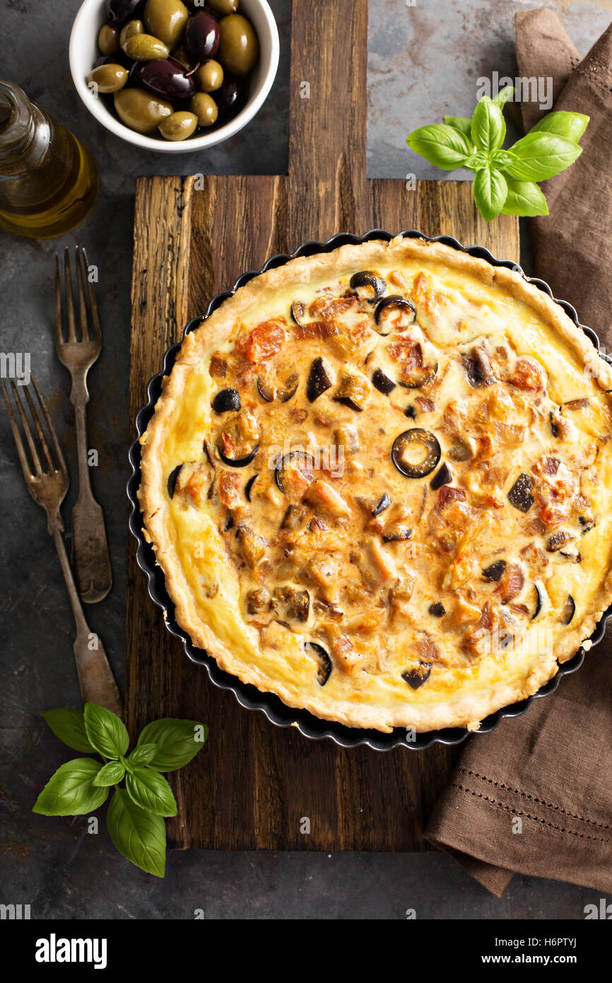 Quiche with eggplant, chicken and olives Stock Photo
