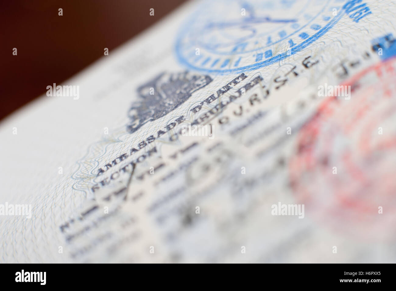 Detail of old passport with Haiti embassy visa stamp, selective focus Stock Photo