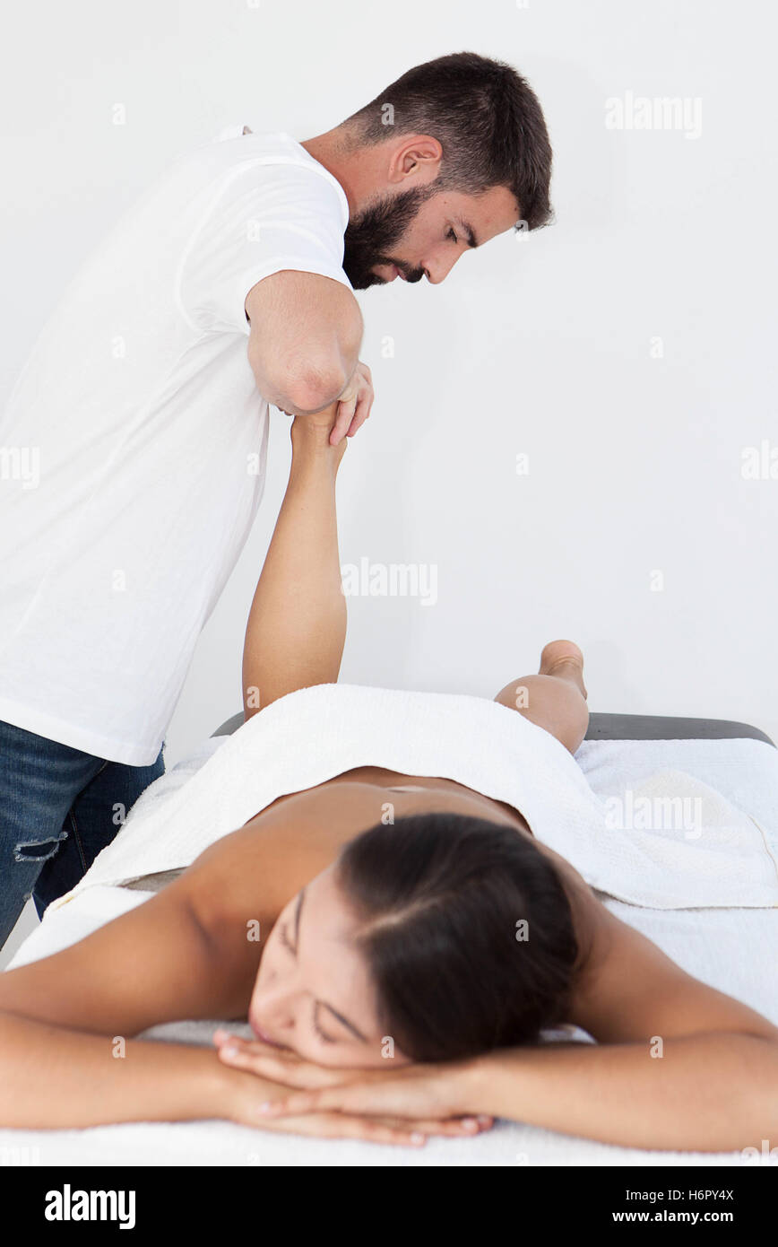 reflexology foot massage treatment. Stock Photo