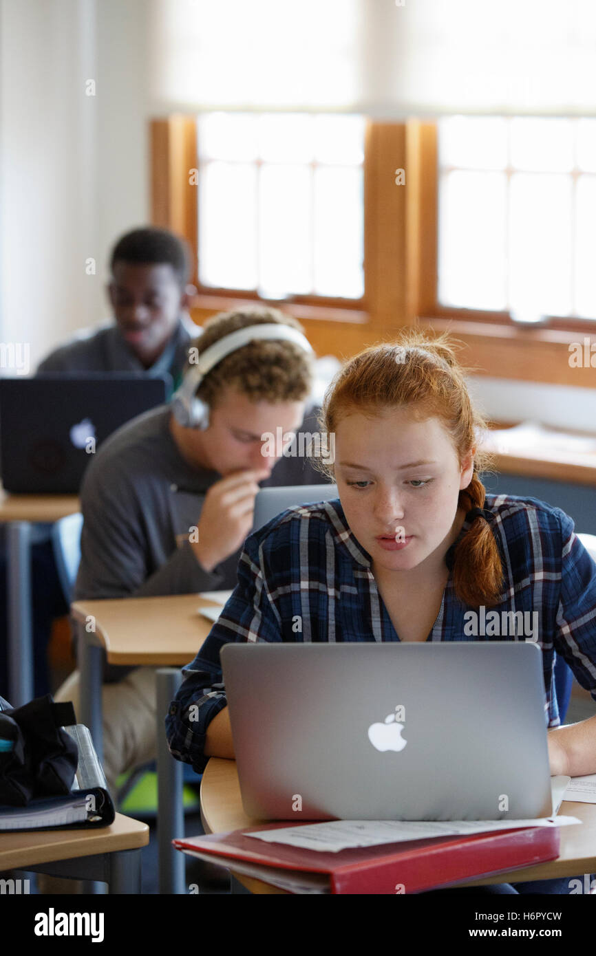 High School students in classroom with laptop computers Stock Photo