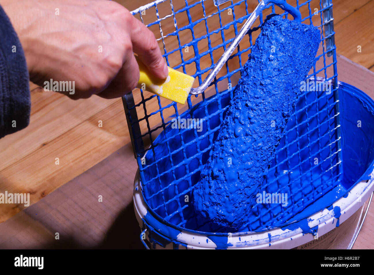 bucket with blue paint and grates Stock Photo Alamy