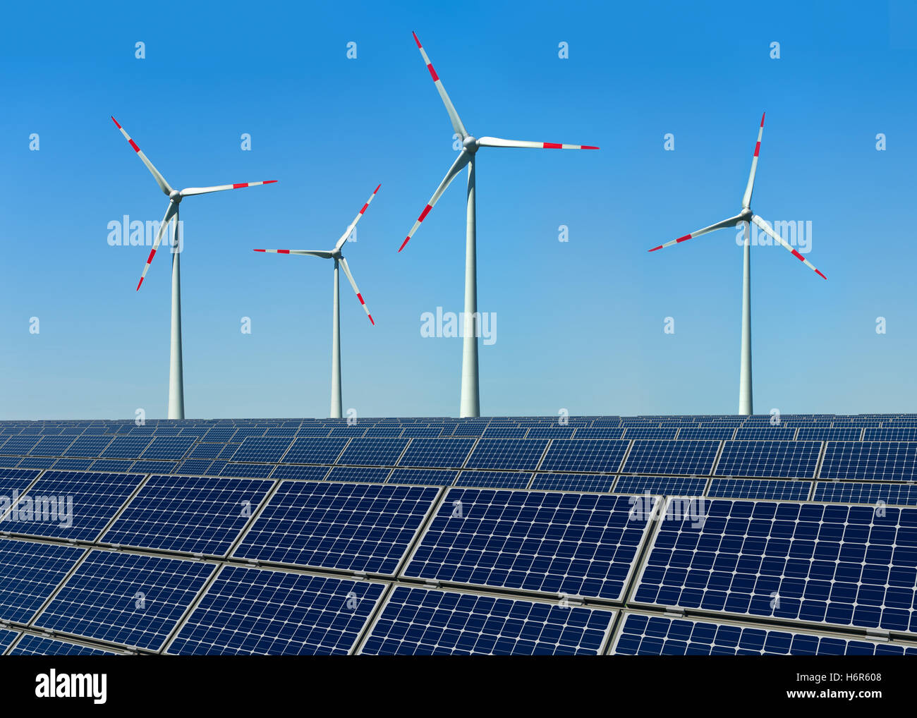 wind turbines and solar panels against a blue sky Stock Photo - Alamy