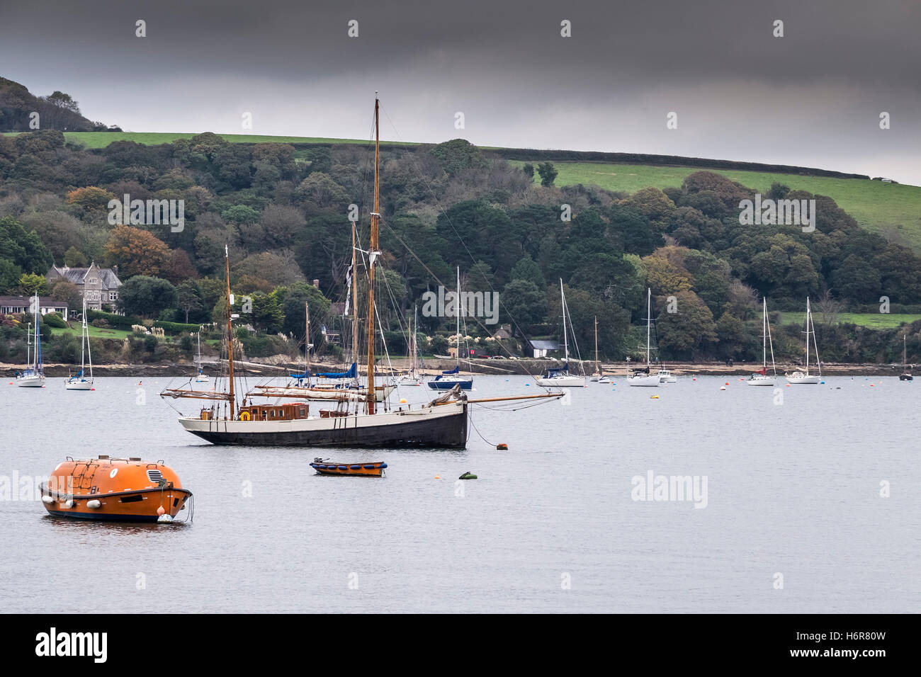 Various boats moored in Carrick Roads in Falmouth, Cornwall. Stock Photo