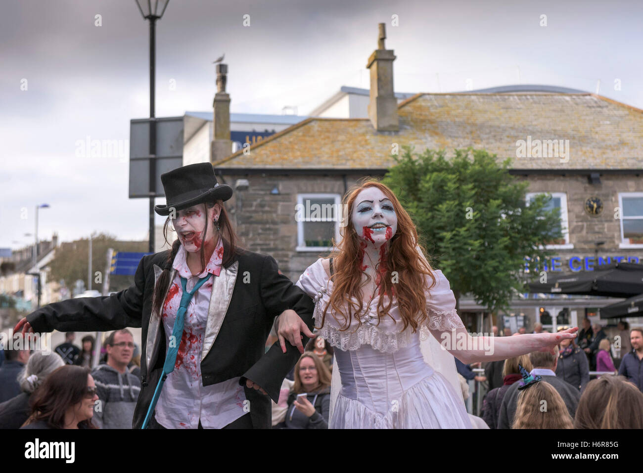 Zombies.  Families and children gather for the annual Zombie Crawl in Newquay, Cornwall. Stock Photo