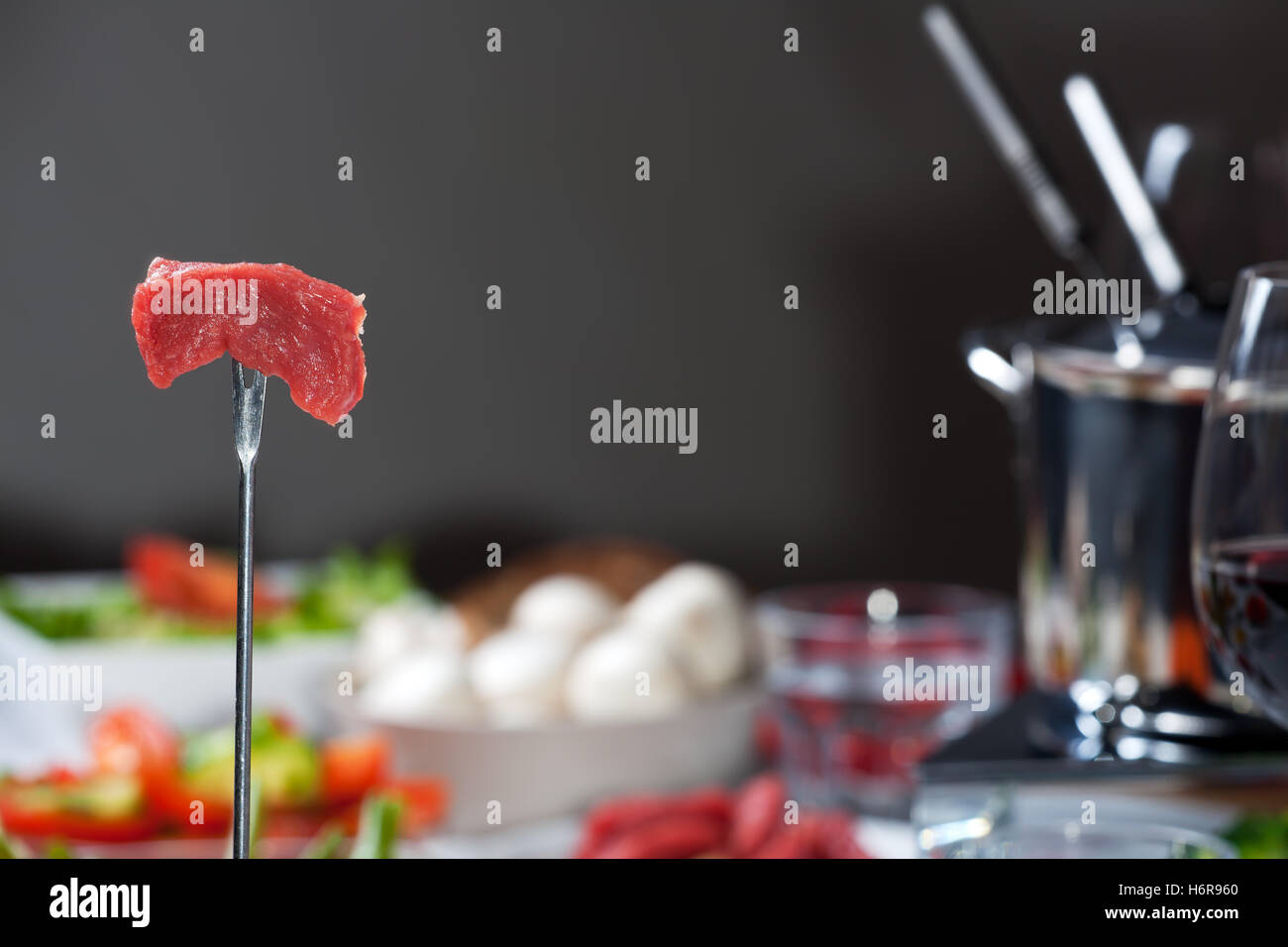 fondue fork with meat Stock Photo