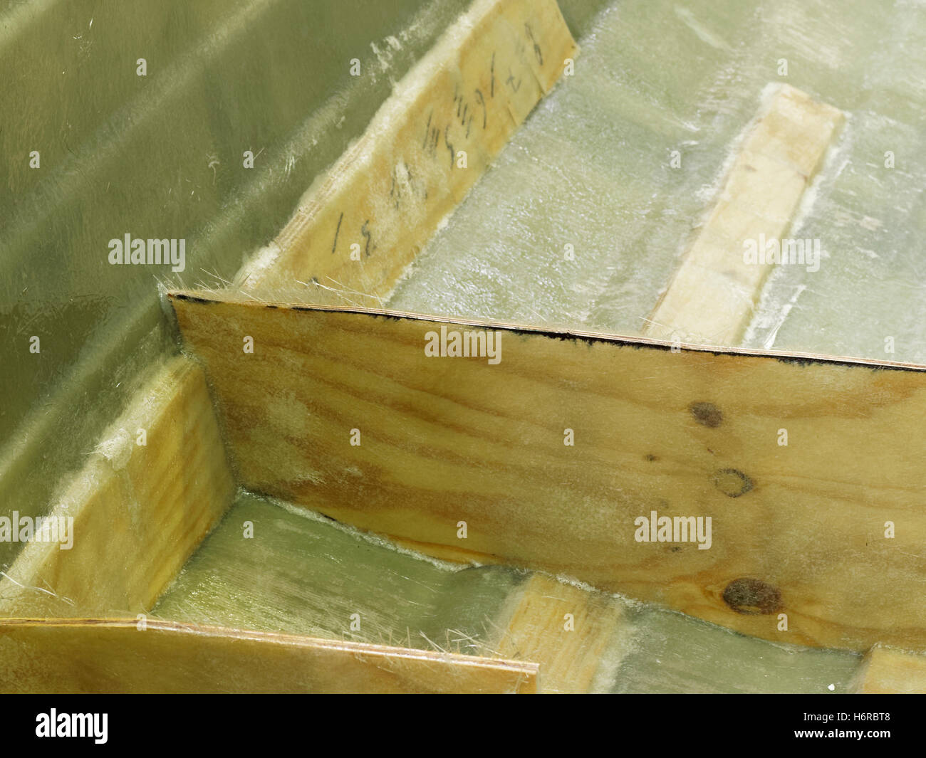 Unfinished boat hull during production (made from fiberglass) in