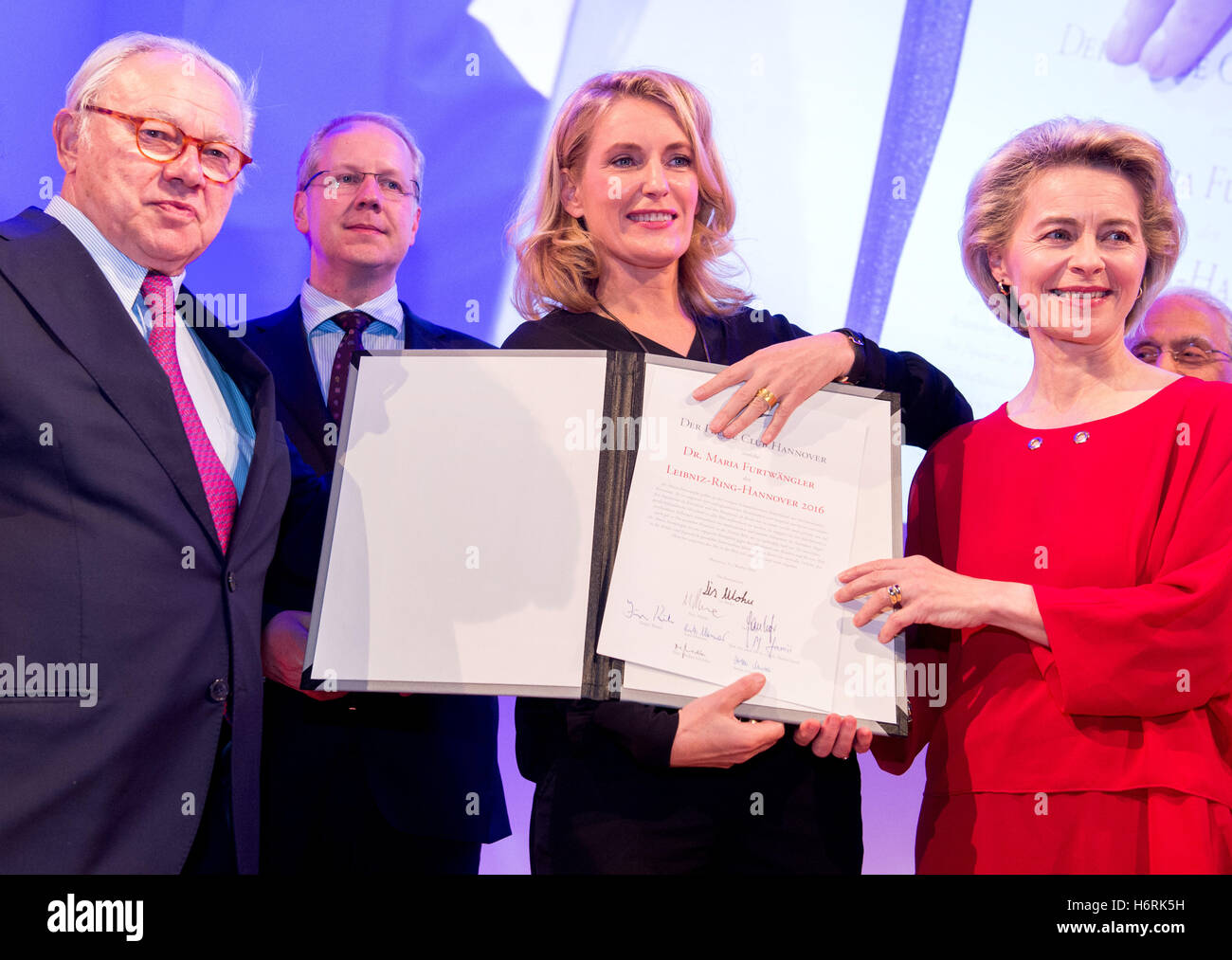 German actress Maria Furtwaengler (C) with her husband, publisher Hubert Burda (L), Mayor of Hanover Stefan Schostock (2-L) and Minster for Defence Ursula von der Leyen (R) after receiving the Leibinz Ring, an award for special achievements awarded by the Press Club Hanover since 1997, in Hanover, Germany, 31 October 2016. Furtwaengler received the award for her work for the prevention of violence against children. The original ring, made especially for Furtwaengler, was stolen. Furtwaengler was presented with a hastily made replica of the original. Photo: Hauke-Christian Dittrich/dpa Stock Photo