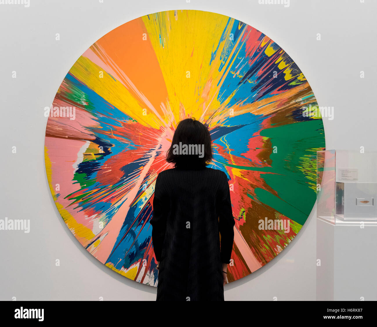London, UK. 1st Nov, 2016. A staff member views 'Beautiful, shattering, slashing, violent, pinky, hacking, sphincter painting' by Damian Hirst, est. GBP250-350k. The first look of 'Bowie/Collector', artworks from the late David Bowie's personal art collection, ahead of their sale later this month at Sotheby's. Credit:  Stephen Chung/Alamy Live News Stock Photo