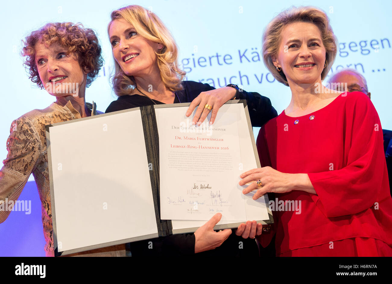 Actress Maria Furtwaengler (M) poses with her mother Kathrin Ackermann (L) and the Federal Defence Minister Ursula von der Leyen (R)in Hanover, Germany, 31 October 2016. Furtwaengler received the Leibniz-Ring of the press club Hanover for her work against child abuse. Several days before the ceremony the ready-made gem was stolen. Photo: Hauke-Christian Dittrich/dpa Stock Photo
