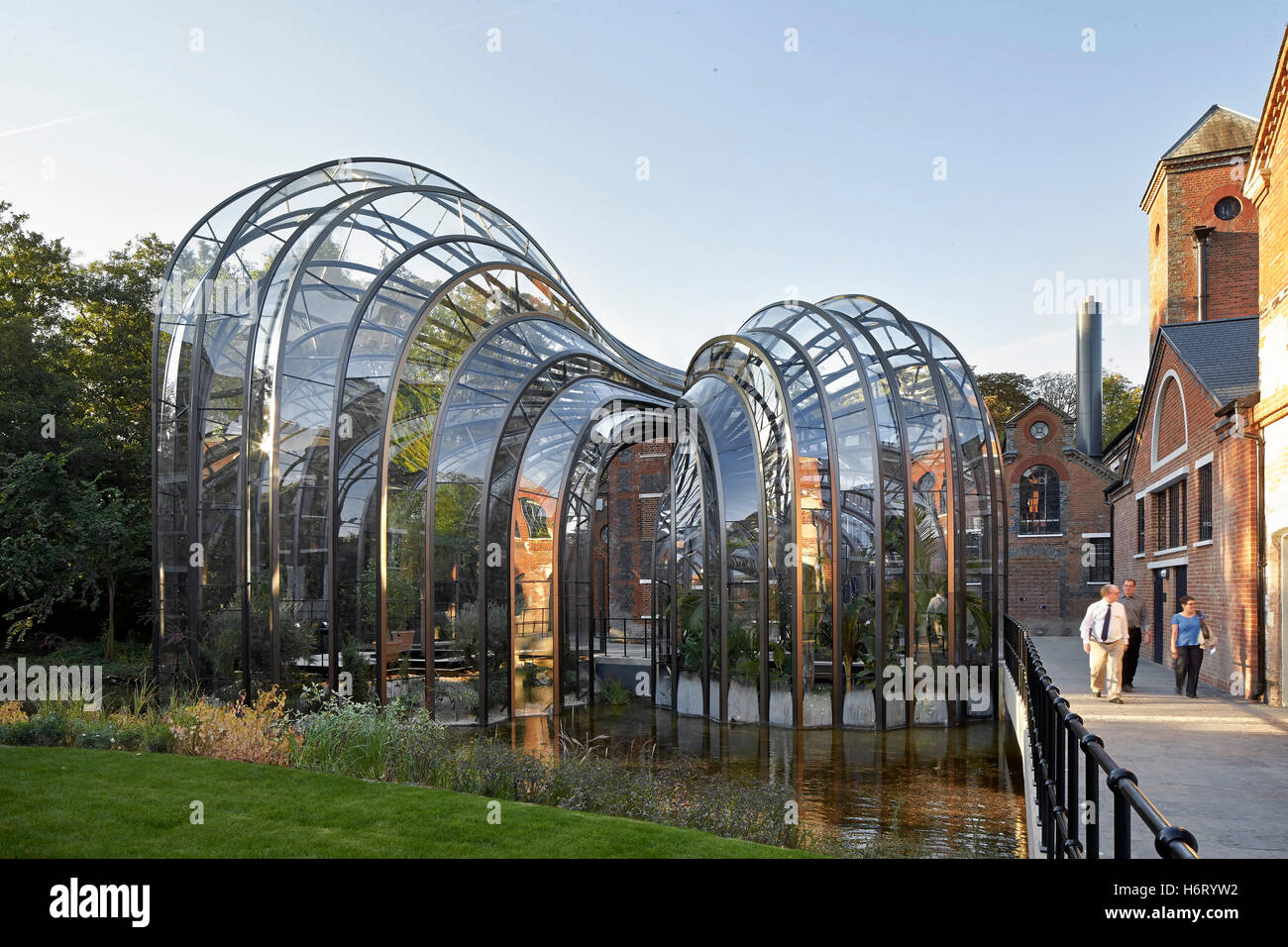 Historic mill site with curving greenhouse additions. Bombay Sapphire ...