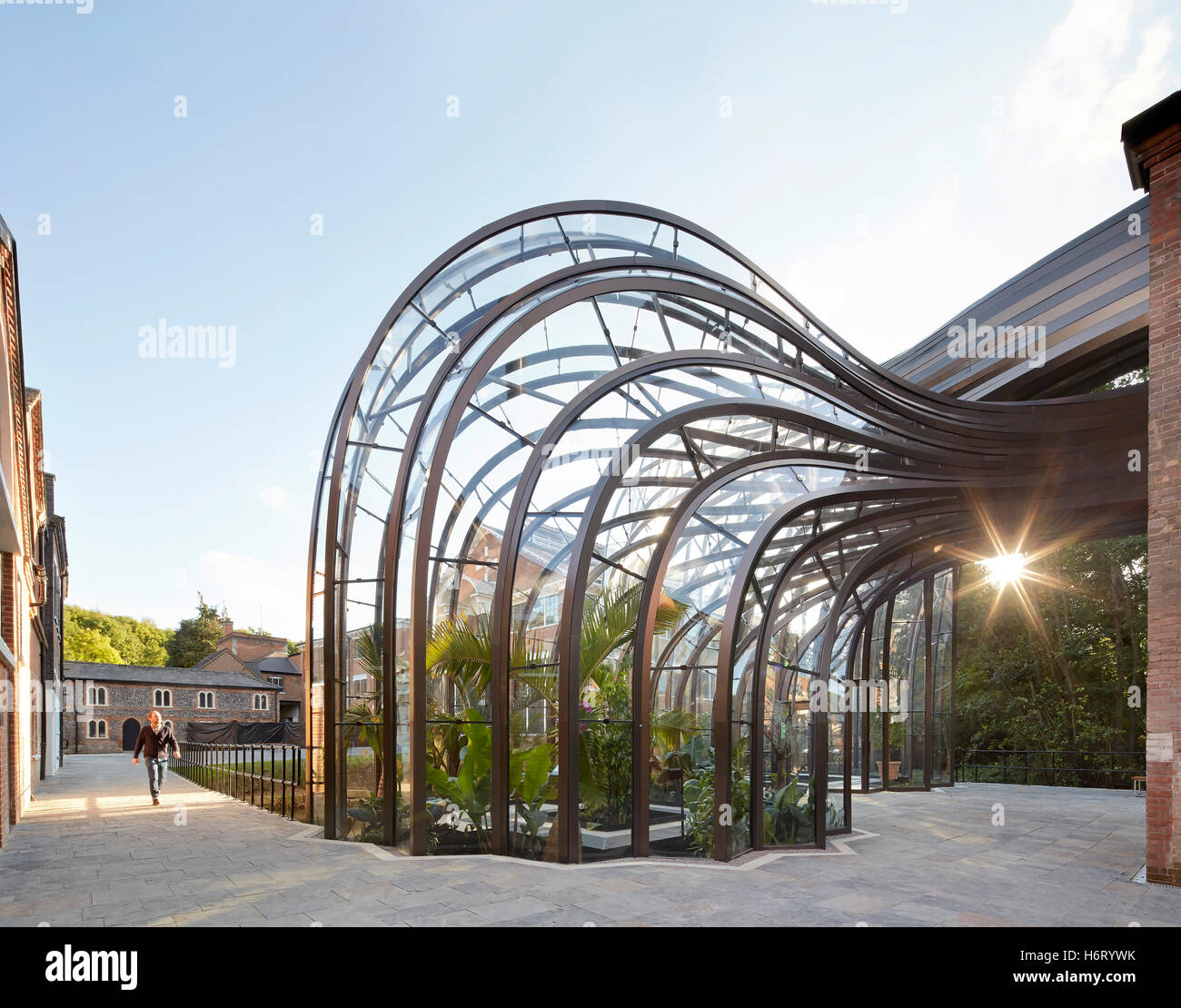 Historic mill site with curved greenhouse volume. Bombay Sapphire ...