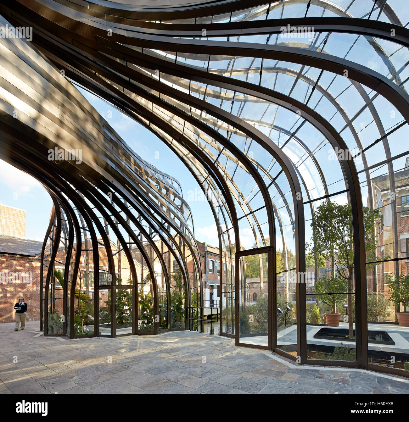 Curved greenhouse structures forming archway. Bombay Sapphire ...