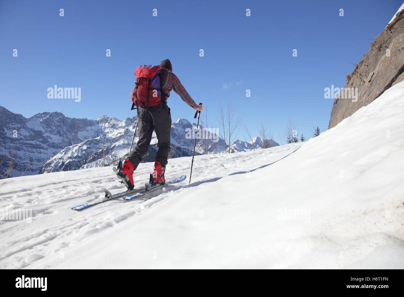 mountains person rise climb climbing ascend uphill tread clamber ascent ski route skier alpinist man skiers sport sports Stock Photo