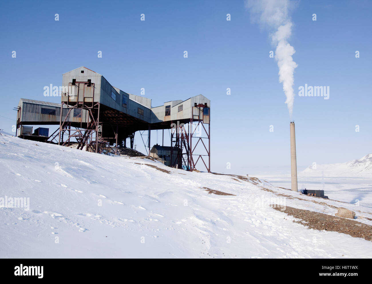 norway bucket coal central trolley cart down belt conveyor old building mine run svalbard spitsbergen Stock Photo