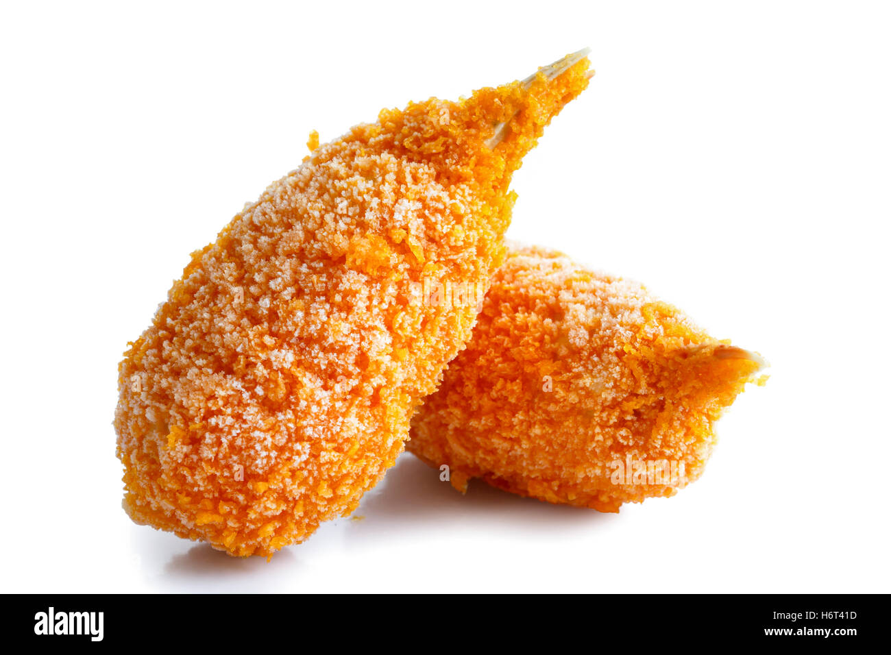 Two frozen breaded surimi crab claws in perspective, isolated on white. Stock Photo