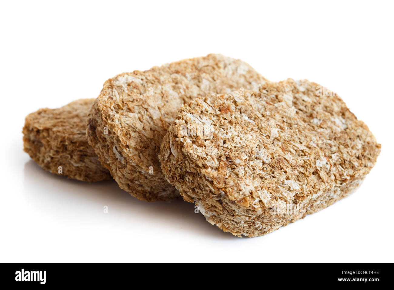 Three whole wheat breakfast biscuits isolated on white in perspective Stock Photo Alamy