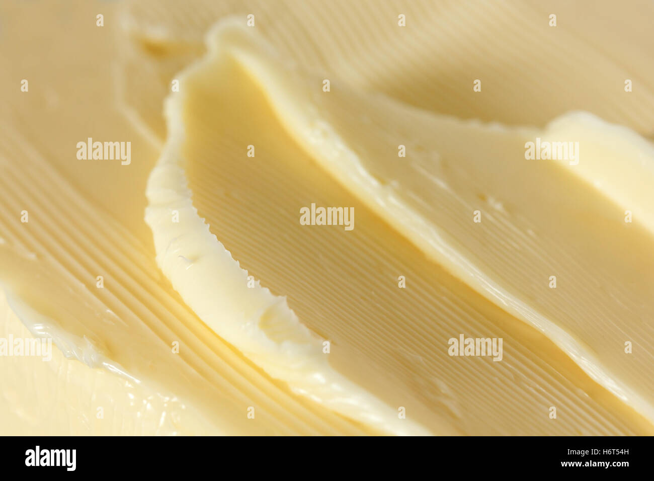 Soft butter spread into an abstract shape Stock Photo