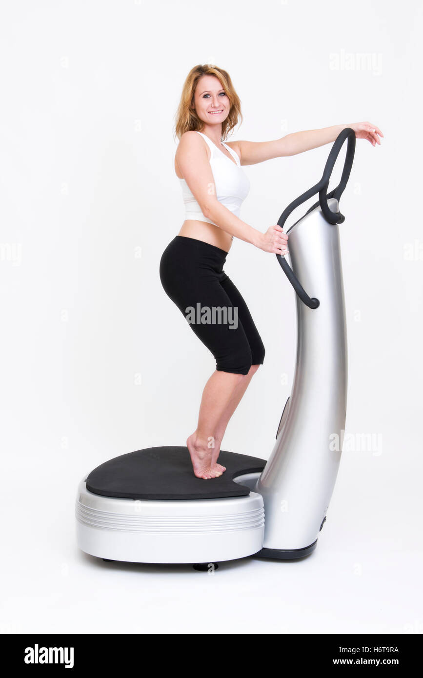 young woman exercising on power plate Stock Photo Alamy
