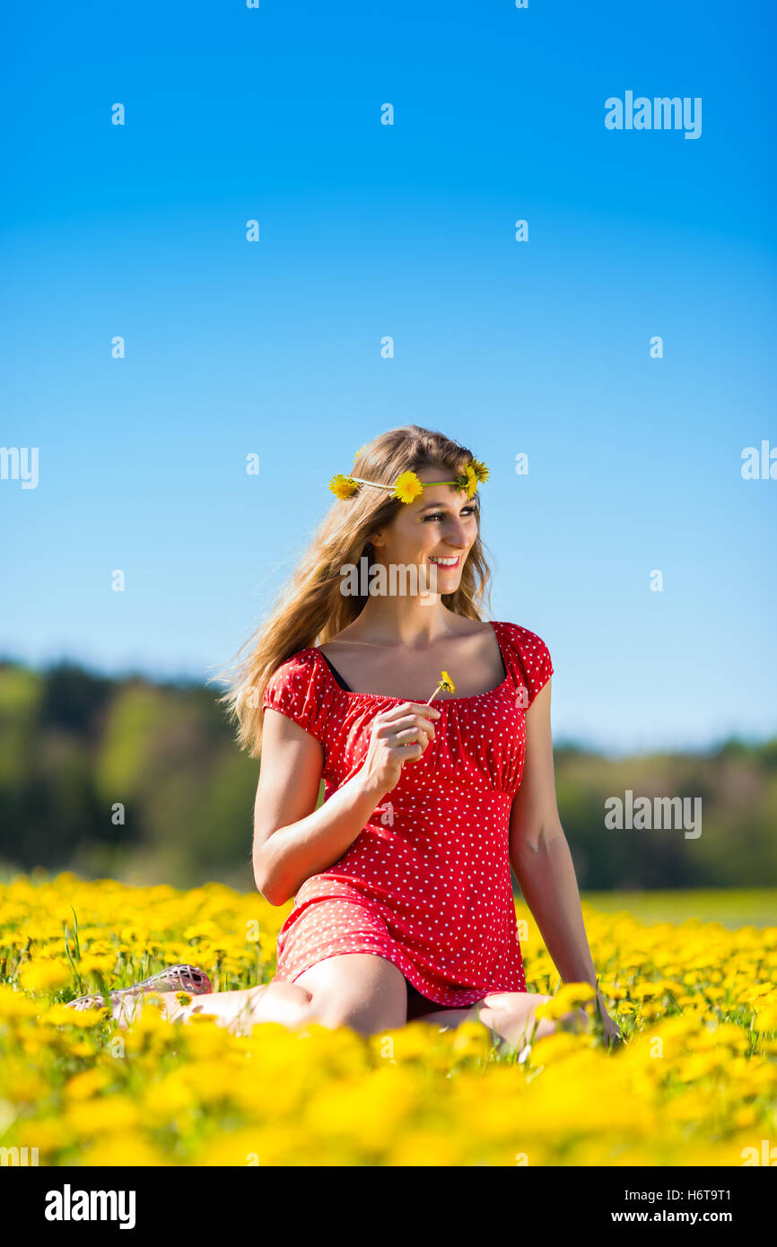 girl in the spring on a flower meadow Stock Photo